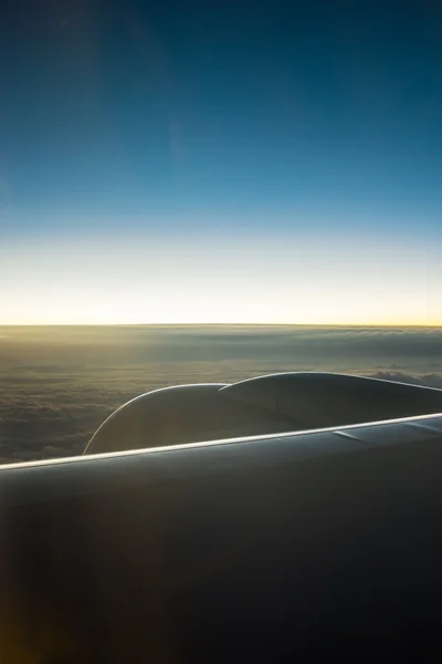 Clouds and sky as seen through window of an aircraft — Stock Photo, Image