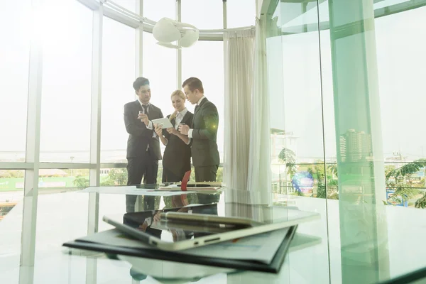 Business partners discussing documents and ideas at meeting — Stock Photo, Image