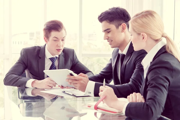 Business partners discussing documents and ideas at meeting — Stock Photo, Image