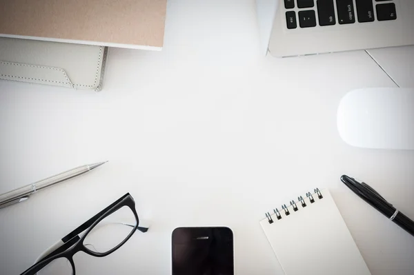 Office desk table with computer, supplies, flower and coffee cup — Stock Photo, Image