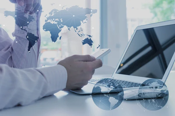 Work desk of businessman with laptop, globalization business con — Stock Photo, Image