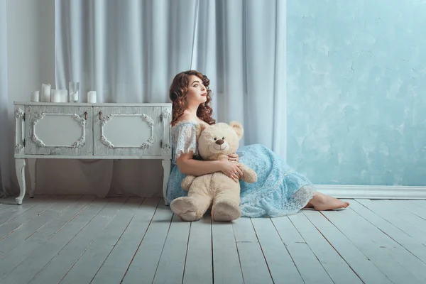 Woman with a toy bear. — Stock Photo, Image