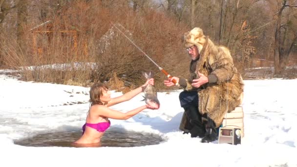 Winter Fishing Hole Woman Dives Fish Ice — Stock Video