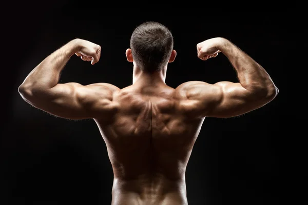 Man back shows big muscles. — Stock Photo, Image