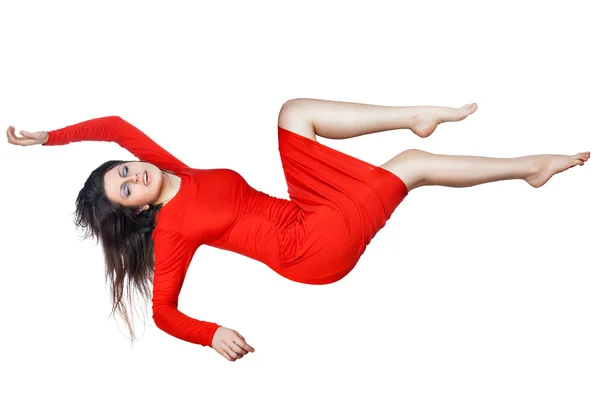 Levitates woman in a red dress. Stock Image