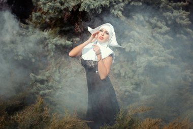 Girl wearing a nun. clipart