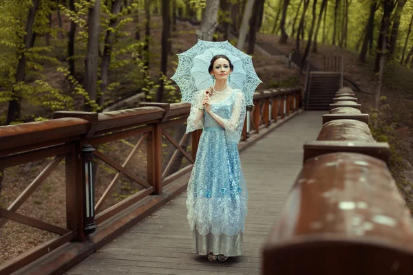 The girl with an umbrella. — Stock Photo, Image