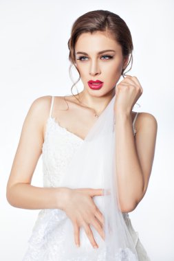 The bride hugged her veil.