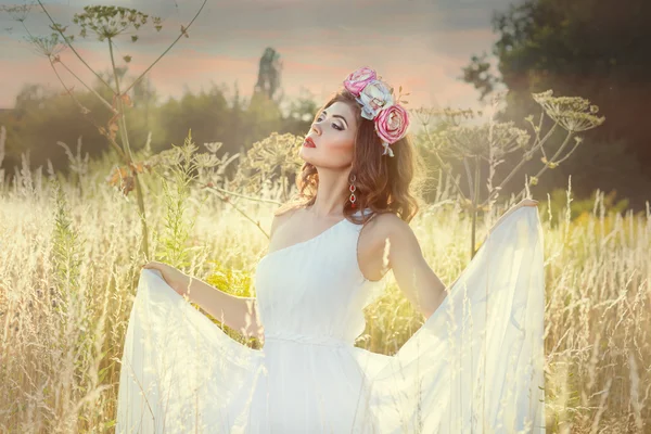 In the field among grass is girl. — Stock Photo, Image