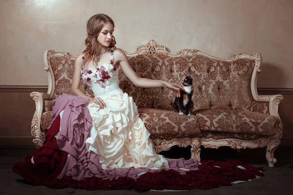 Girl in beautiful dress with a train. — Stock Photo, Image