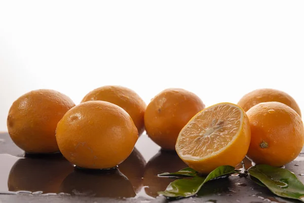 citrus fruits lemons on a wet plate. Healthy food, healthy lifestyle. food from nature