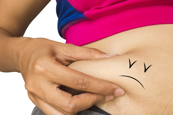 Junge schlanke Frau wenig Fett auf ihrem Bauch mit von Hand gezogenem traurigen Schnitt Stockfoto