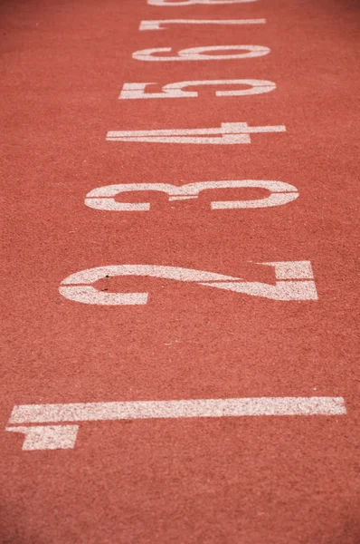 Running track closeup numbers two in stadium