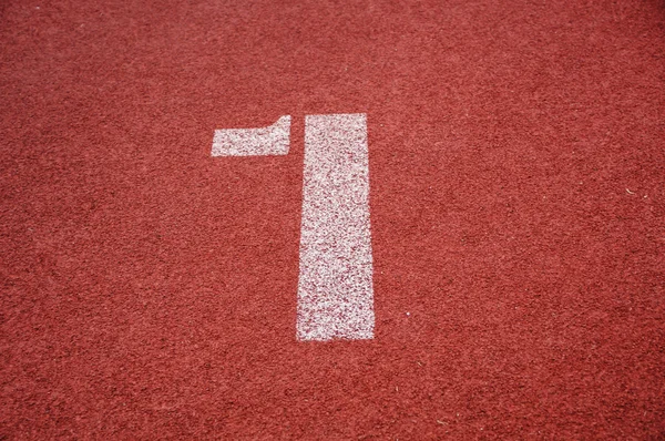Number one on the start of a running track - check my portfolio