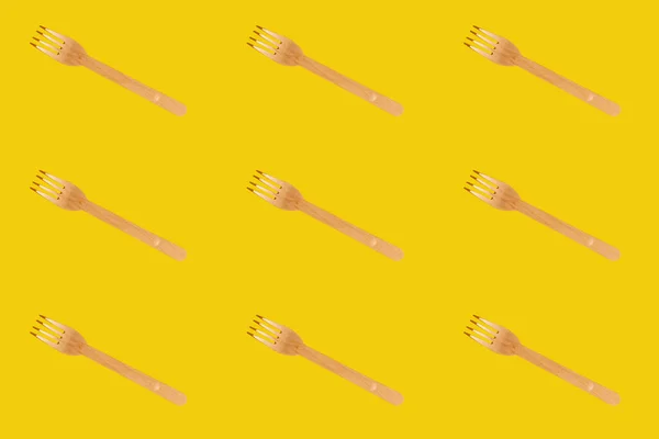 Wooden Brown Disposable Tableware Fork Pattern Yellow Background Environmentally Friendly — Fotografia de Stock