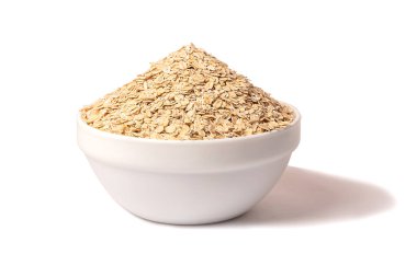 A bowl of dry oatmeal. Healthy, simple breakfast food. Diet concept. On white background.