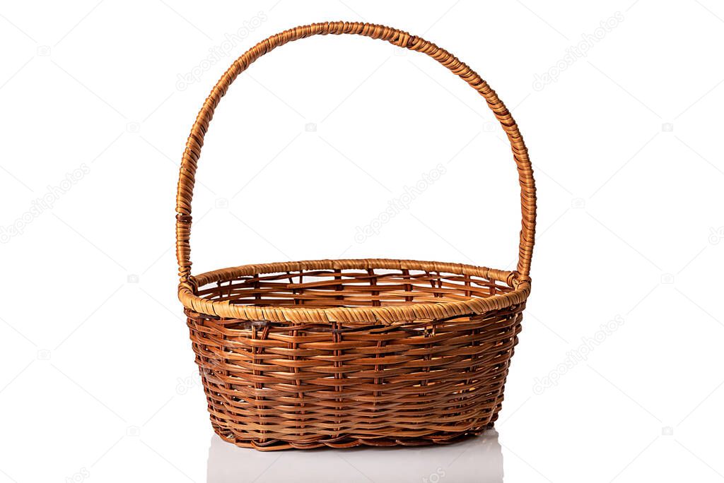 Brown wicker basket. Handmade. On white background.