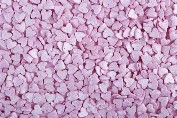 Superficie Rosa Está Cubierta Con Montón Confeti Rosa Forma Corazón —  Fotos de Stock