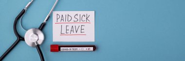 A positive covid test and a medical phonendoscope with the inscription paid sick leave on a blue background. FMLA Family Medical Leave Act clipart