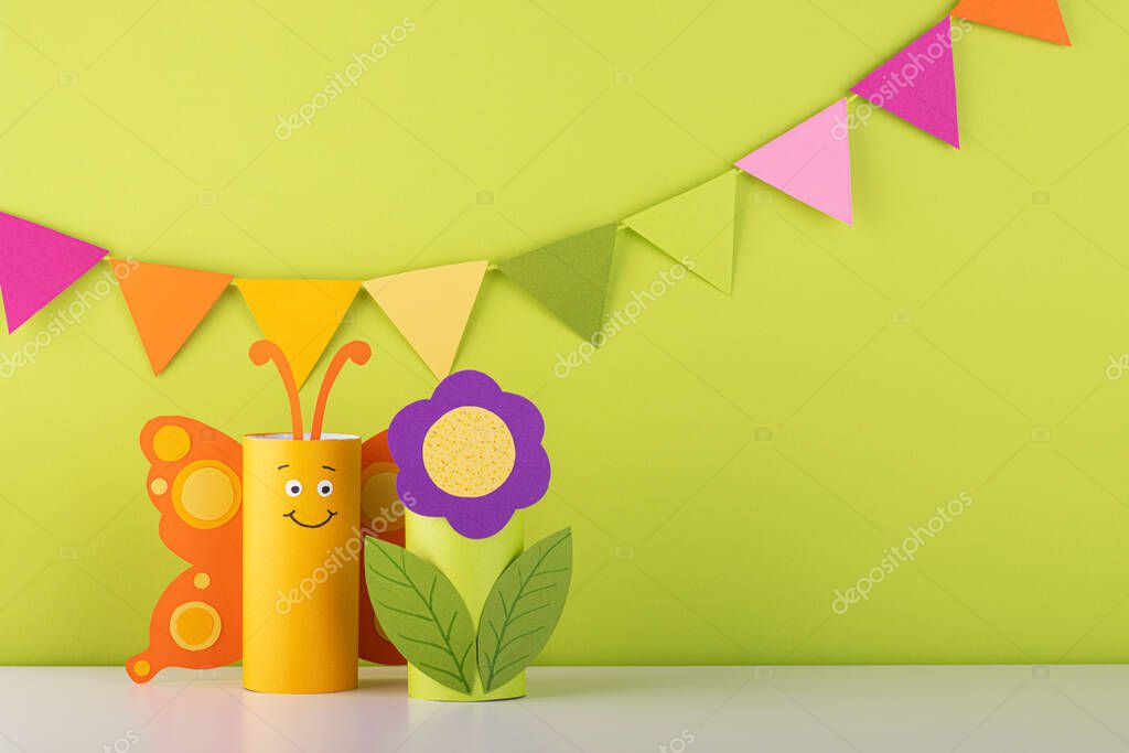 Cute paper butterfly made from a toilet paper tube. spring background. recycling