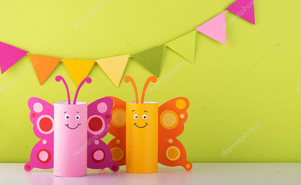 Cute paper butterfly made from a toilet paper tube. spring background. recycling