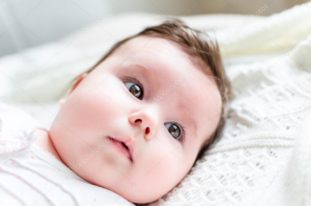 Portrait of cute sweet little newborn baby girl