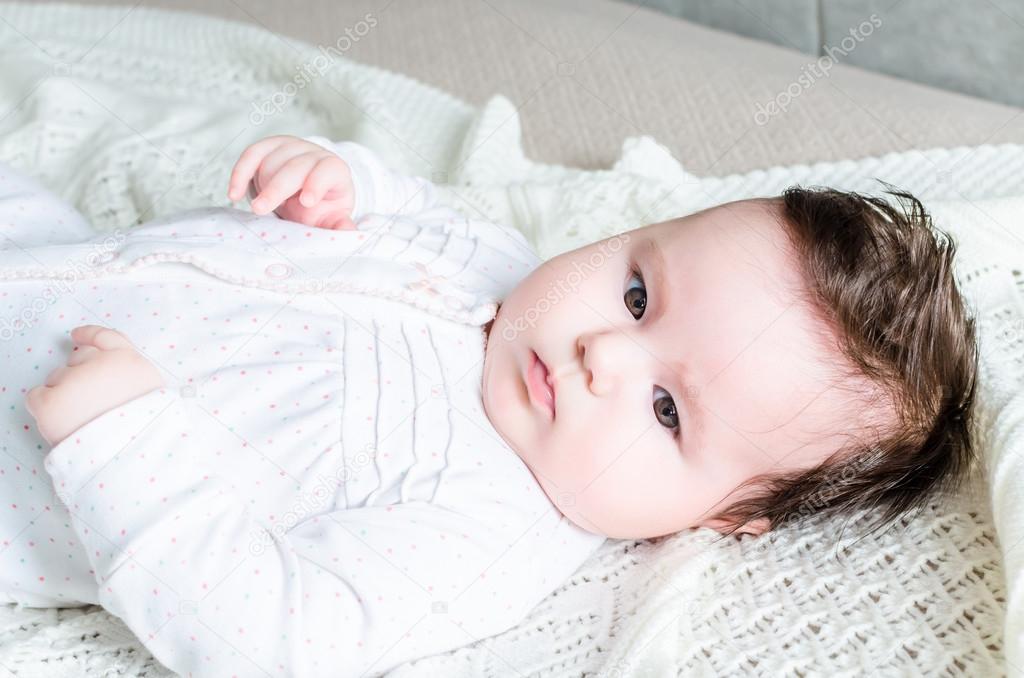 Portrait of cute sweet little newborn baby girl