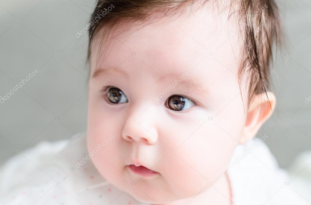 Portrait of cute sweet little newborn baby girl