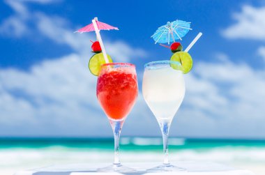 Fresh Margarita cocktails on table against tropical turquoise sea in the Caribbean sea