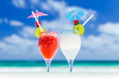 Fresh Margarita cocktails on table against tropical turquoise sea in the Caribbean sea