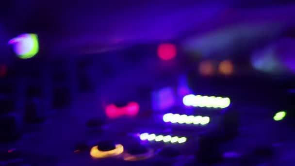 Deejay's hands pushing and turning buttons on the mixing console. Nightclub — Stock Video