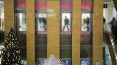 Many people entering large shopping mall on black Friday sale before Christmas