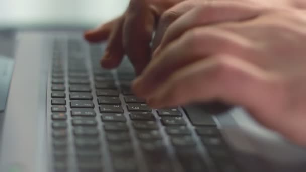 Close up of male fingers pressing buttons on laptop keyboard — Stock Video