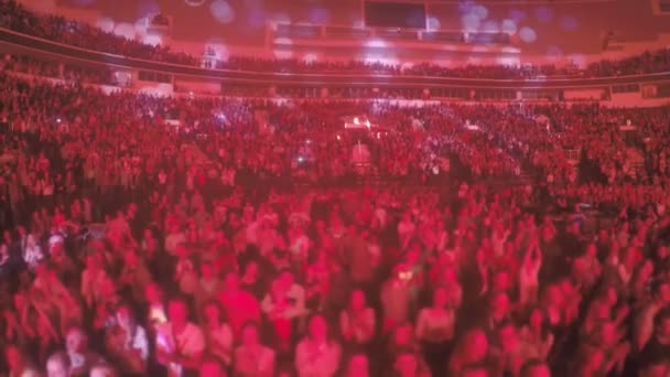 Crowd of fanatic religious sect members applauding to preacher, red illumination — Stock Video