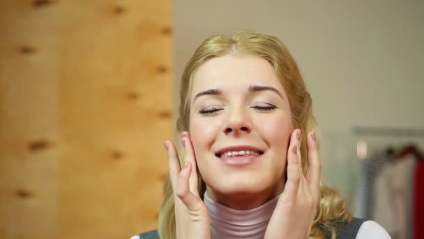 Female applying expensive anti-aging cream, enjoying the smoothing skin effect — Stock Video