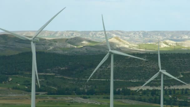 Alternative energy generation, nature conservation. Wind turbines, green hills — Stock Video