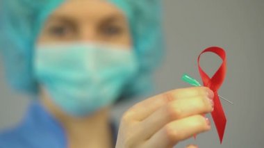 AIDS ve HIV bilinçlendirme kampanyası, kırmızı kurdele, zührevi hastalıklar hakkında uyarı