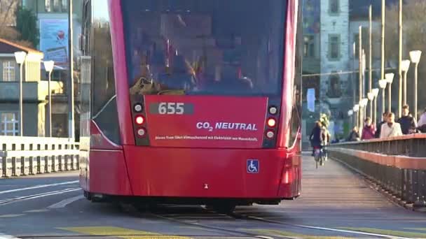 Environmentally safe streetcar carrying passengers in city, ecology problem — Stock Video