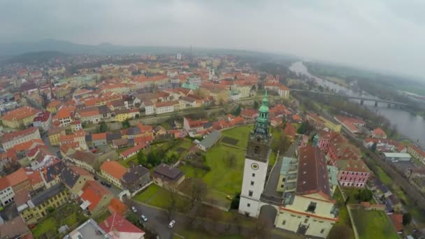 Aerial panorama of old city downtown, city hall tower, mountains on horizon — Stock Video