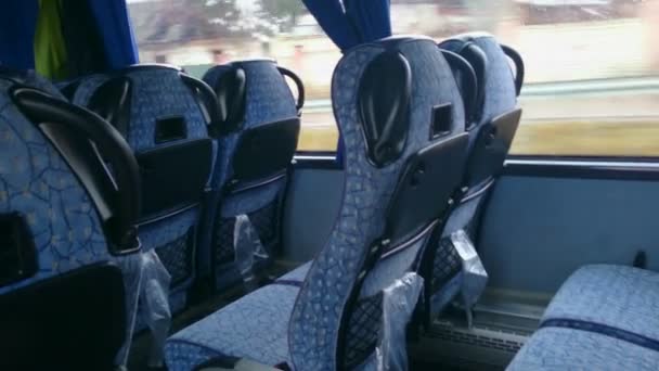 Empty seats inside a low-budget bus, traveling in economy class. Tourism — Stock Video