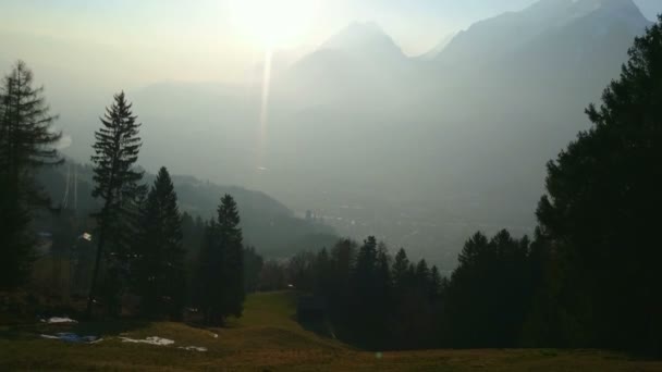 Vertical pan of green mountain valley and sun in blue sky. Beautiful landscape — Stock Video