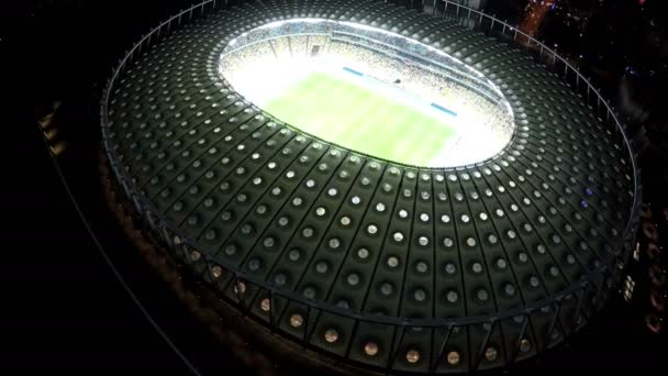 KYIV, UKRAINE - CIRCA JUNE 2016: Aerial view of Olimpiyskiy stadium. Football match at modern sports arena, night time illumination, view from above — Stock Video