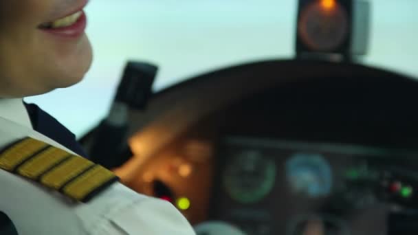 Happy professional pilot in cockpit showing thumbs up sign, enjoying his work — Stock Video