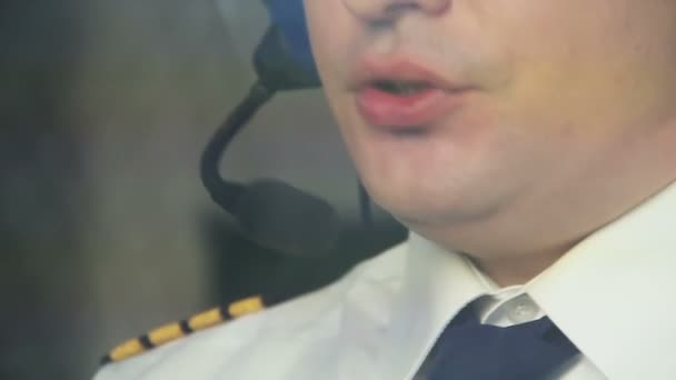 Attentive pilot controlling airplane while flying through turbulence zone — Stock Video