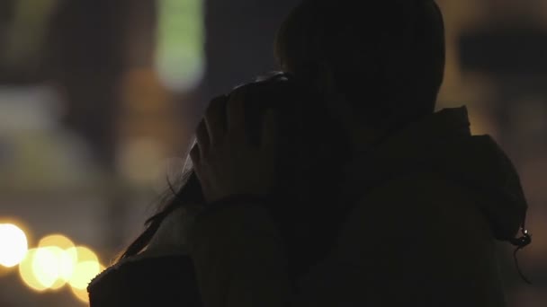 Loving young man hugging girlfriend gently to calm her down, first love story — Stock Video