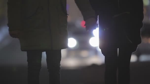 Happy couple holding hands, having fun and joking at romantic date in big city — Stock Video