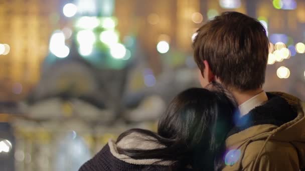 Young couple enjoying romantic date, hugging, looking into future together — Stock Video