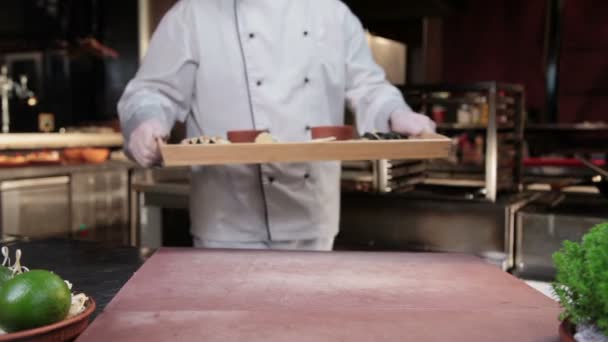 Cook presenting sushi — Stock Video