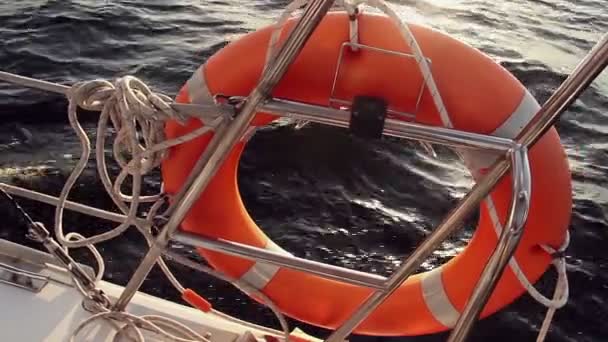 Orange life ring on board of yacht — Stock Video