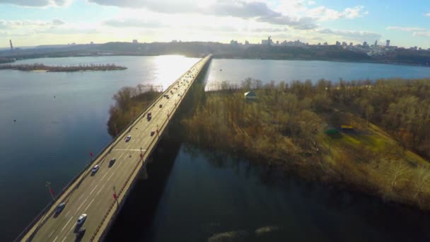 Aerial view of park, bridge across river, city panorama — Stock Video